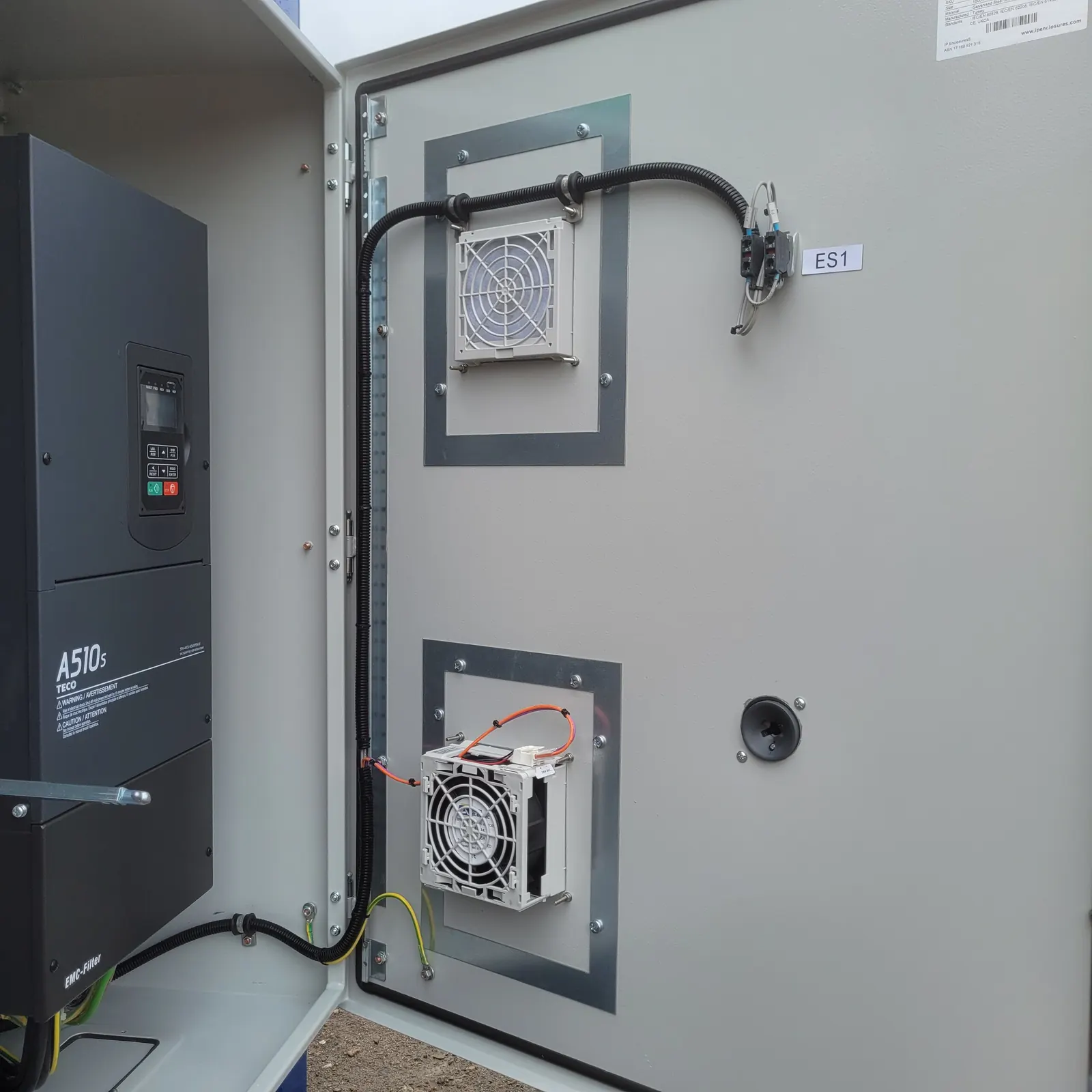 Enclosure fans with quick-access filters on the inside of the panel door