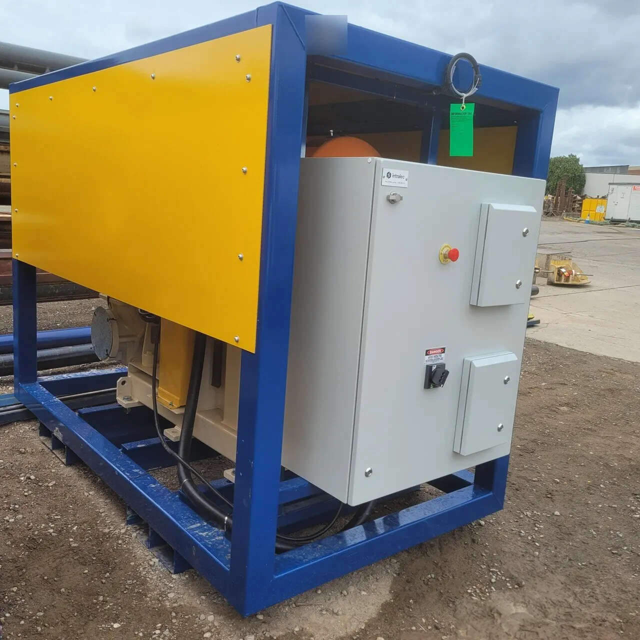 The pump skid from the side, with the control panel fitted to the frame