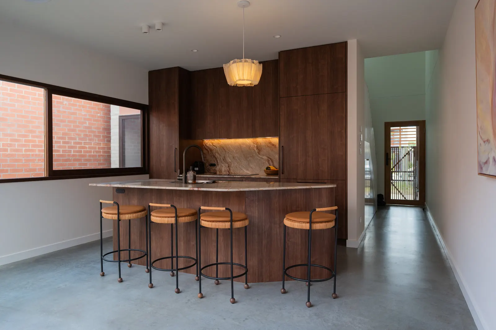 Kitchen lighting, with a pendant over the island and strip lighting under the cabinets