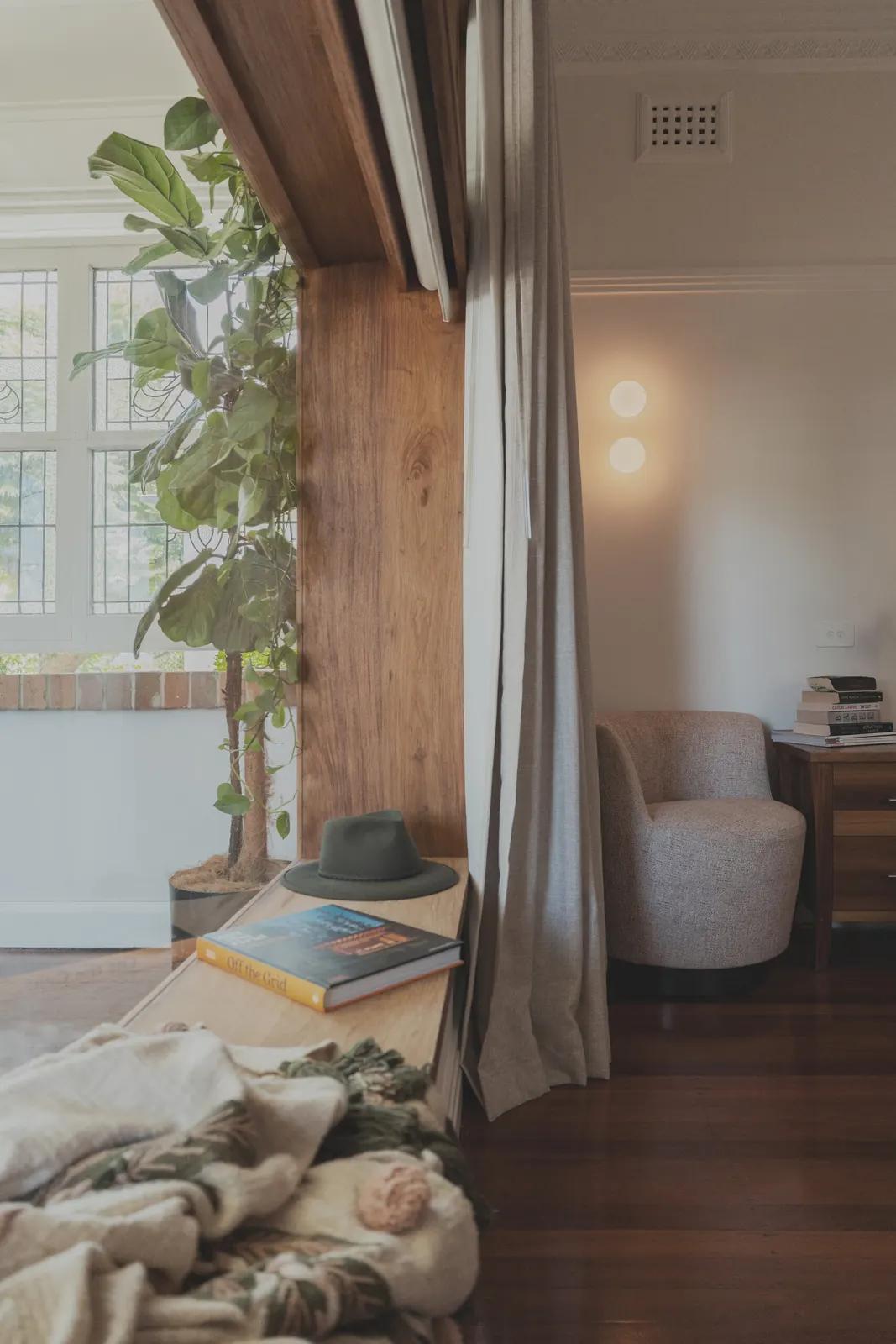 Orb wall lights above a reading chair