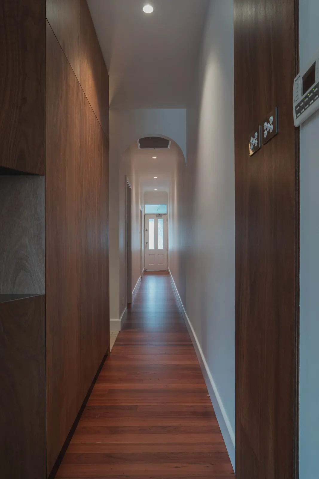 Hallway downlight, with switches set into the timber joinery