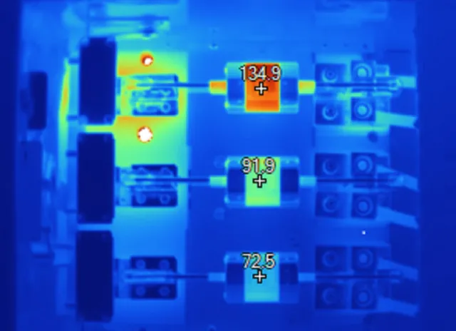 Thermal image of fuses inside a switchboard, one running much hotter than the others