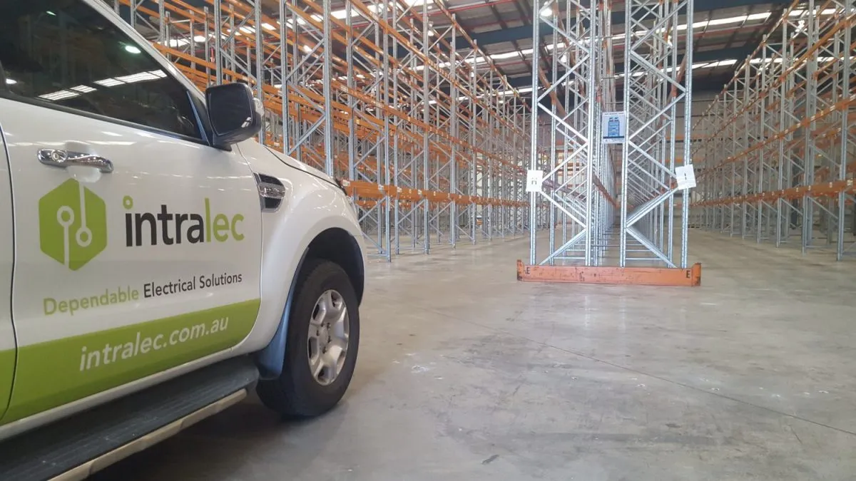 An Intralec vehicle inside a warehouse with pallet racking